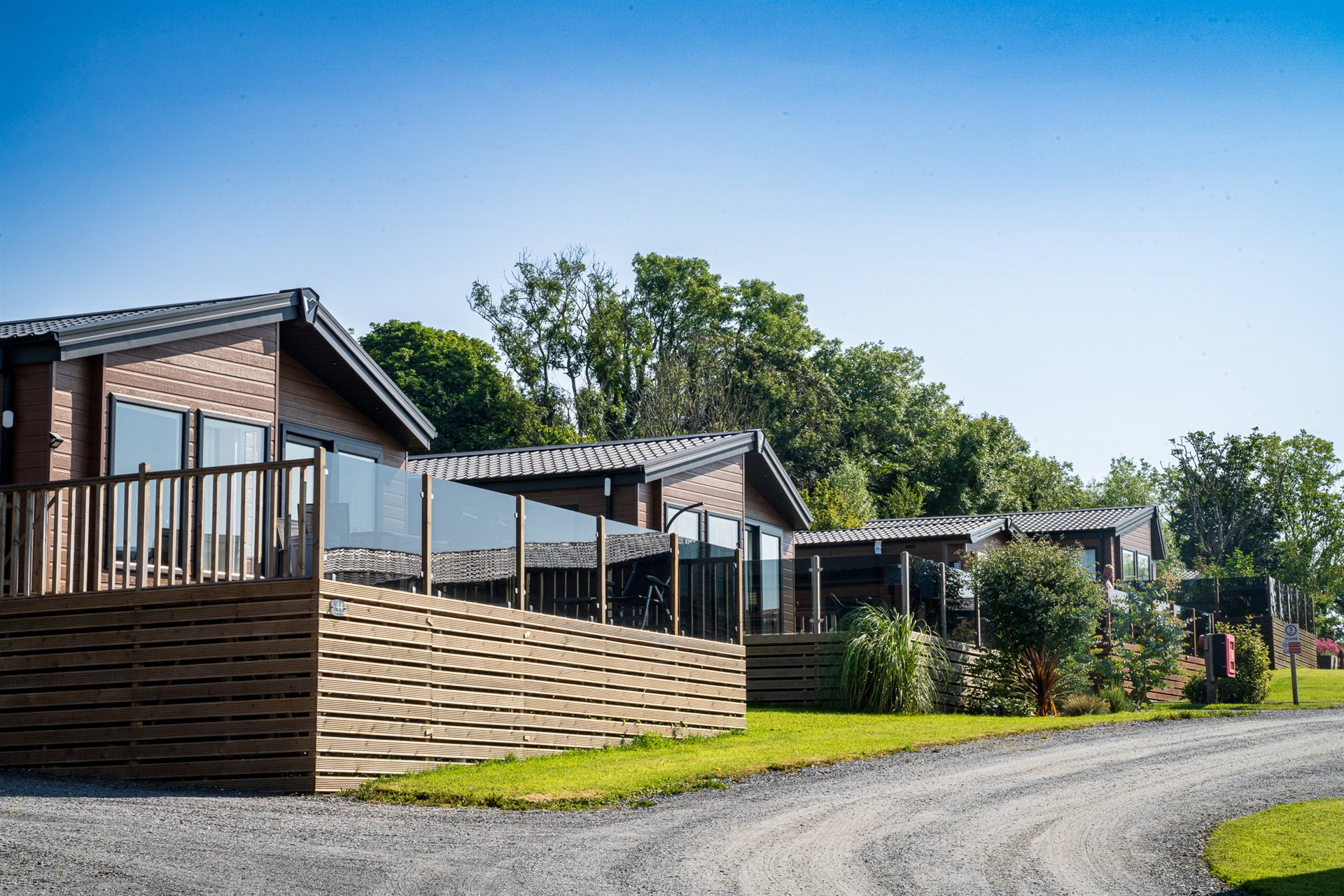 Holiday home and timber deck on a sheltered pitch at Lingwood Park